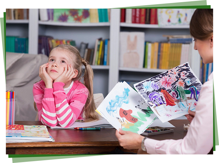 A girl sitting at the table with her mother.