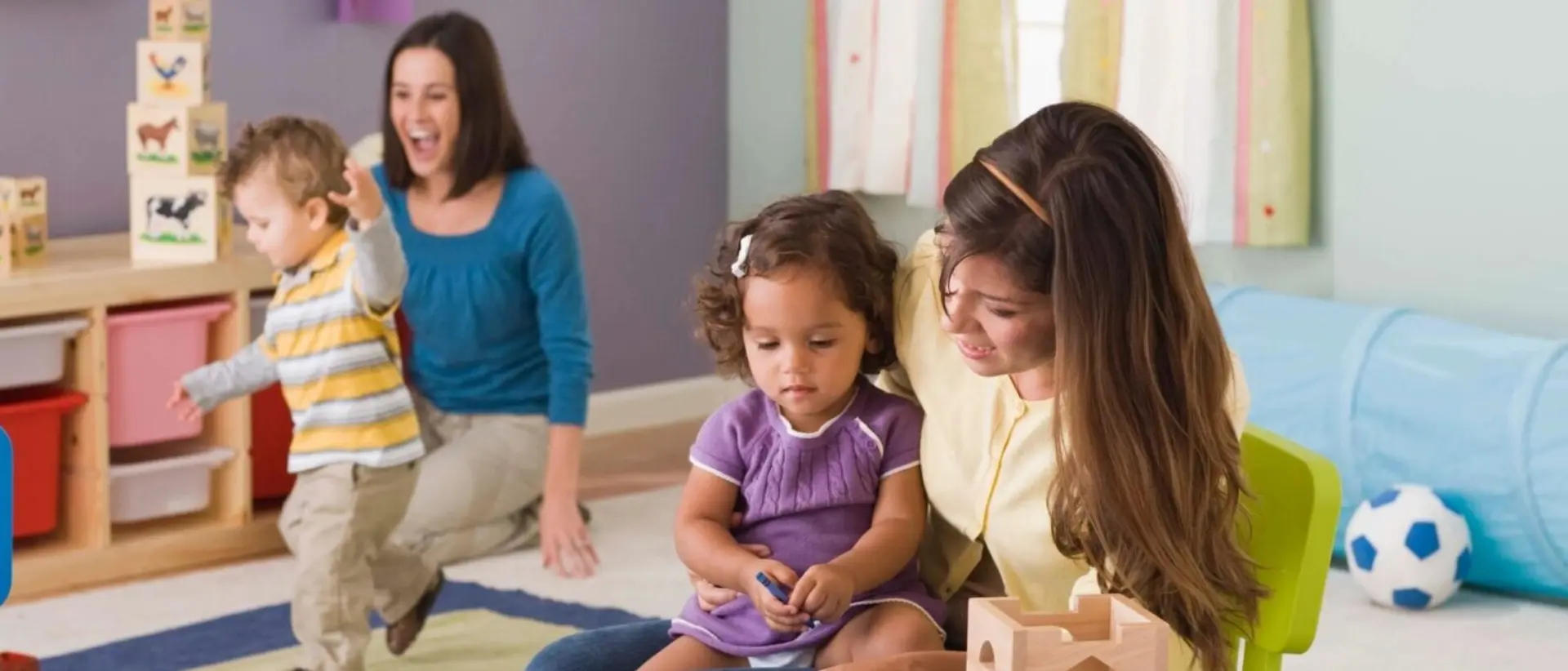 A woman and child sitting on the floor