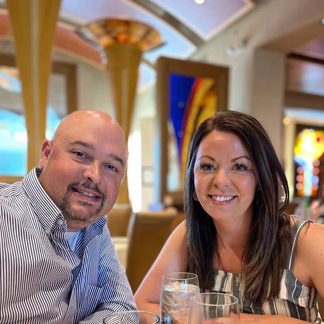 A man and woman sitting at a table.